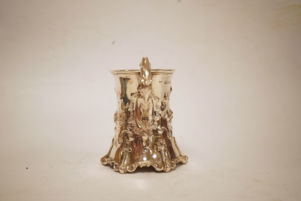 A Victorian embossed silver christening mug, of waisted form, by John Keith, London, 1851, height 10.2cm, 5.8oz.